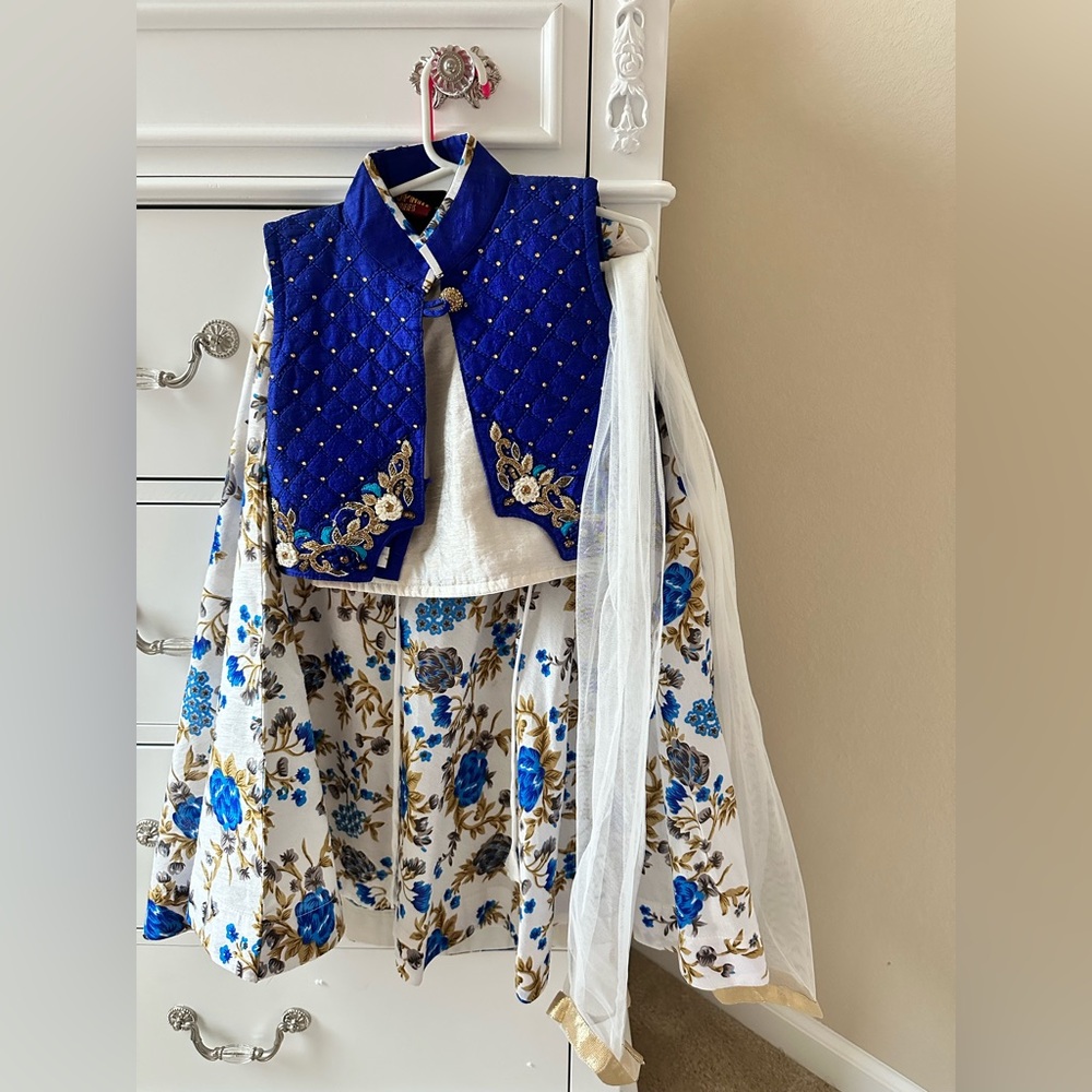 Blue and White Floral Embroidered lehenga.
4pieces-skirt, vest, top and duppatta